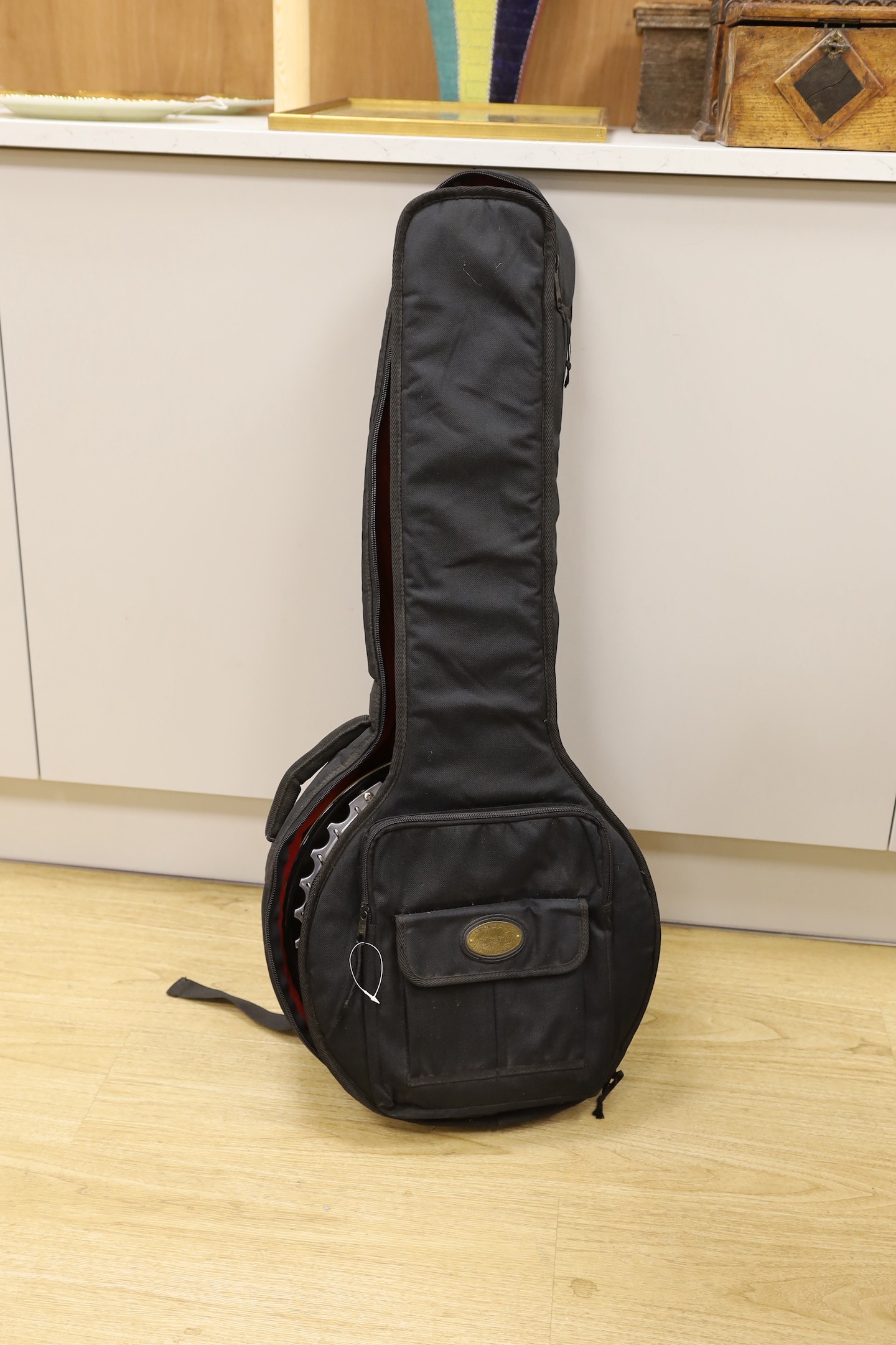 An Ashbury banjo - U.S.A. Weatherking with soft padded case, Banjo 86.5 cms high